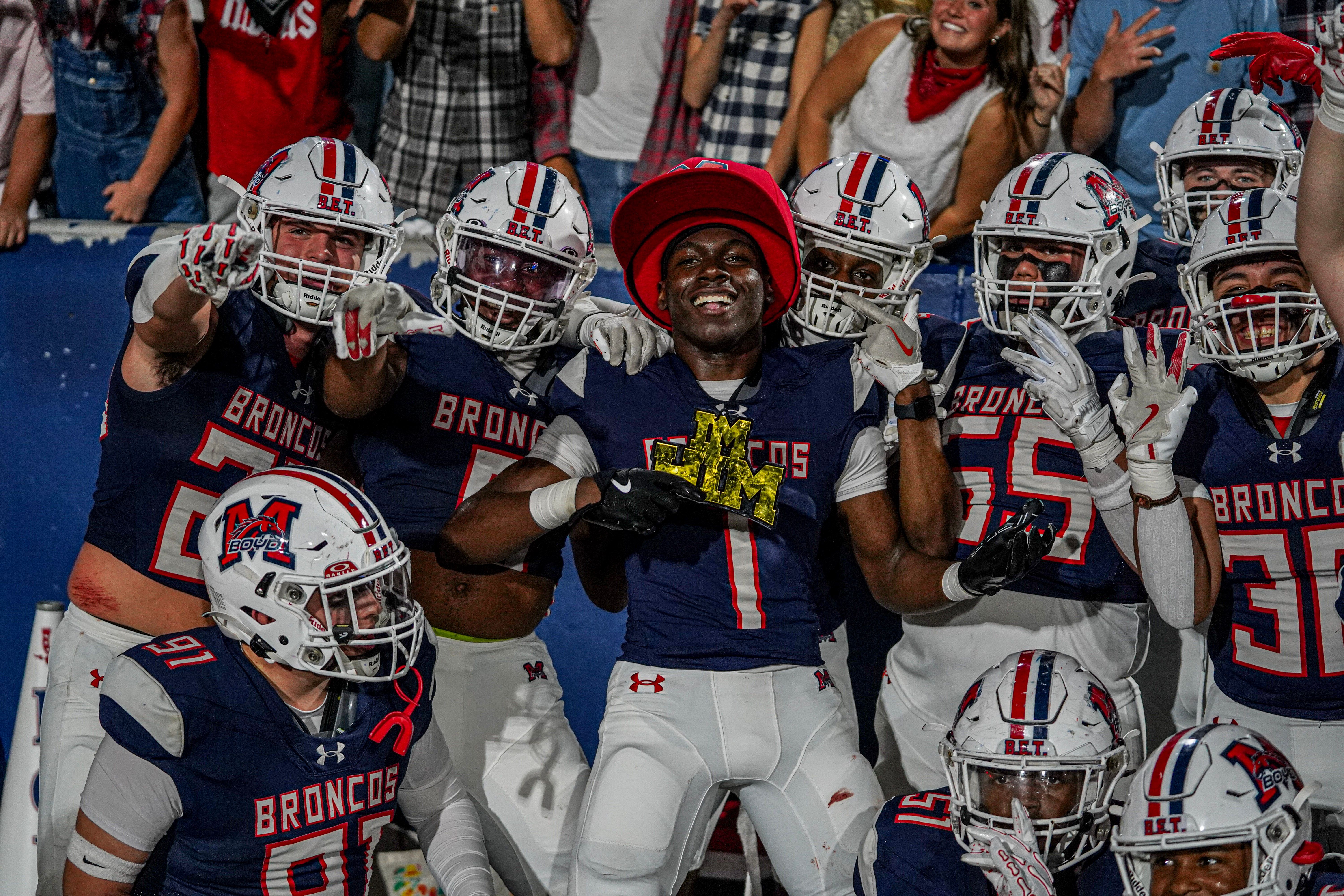 McKinney Boyd Broncos wide receiver breaking a tackle attempt during a Friday night game