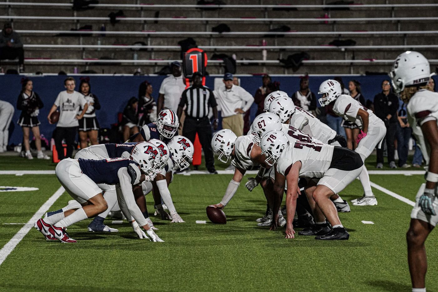 McKinney Boyd Broncos football team lined up at the line of scrimmage during a Friday night game